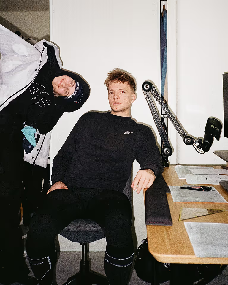 Designer and Webflow developer Jaroslav Dlask in his work room with microphone, monitor, and work desk.